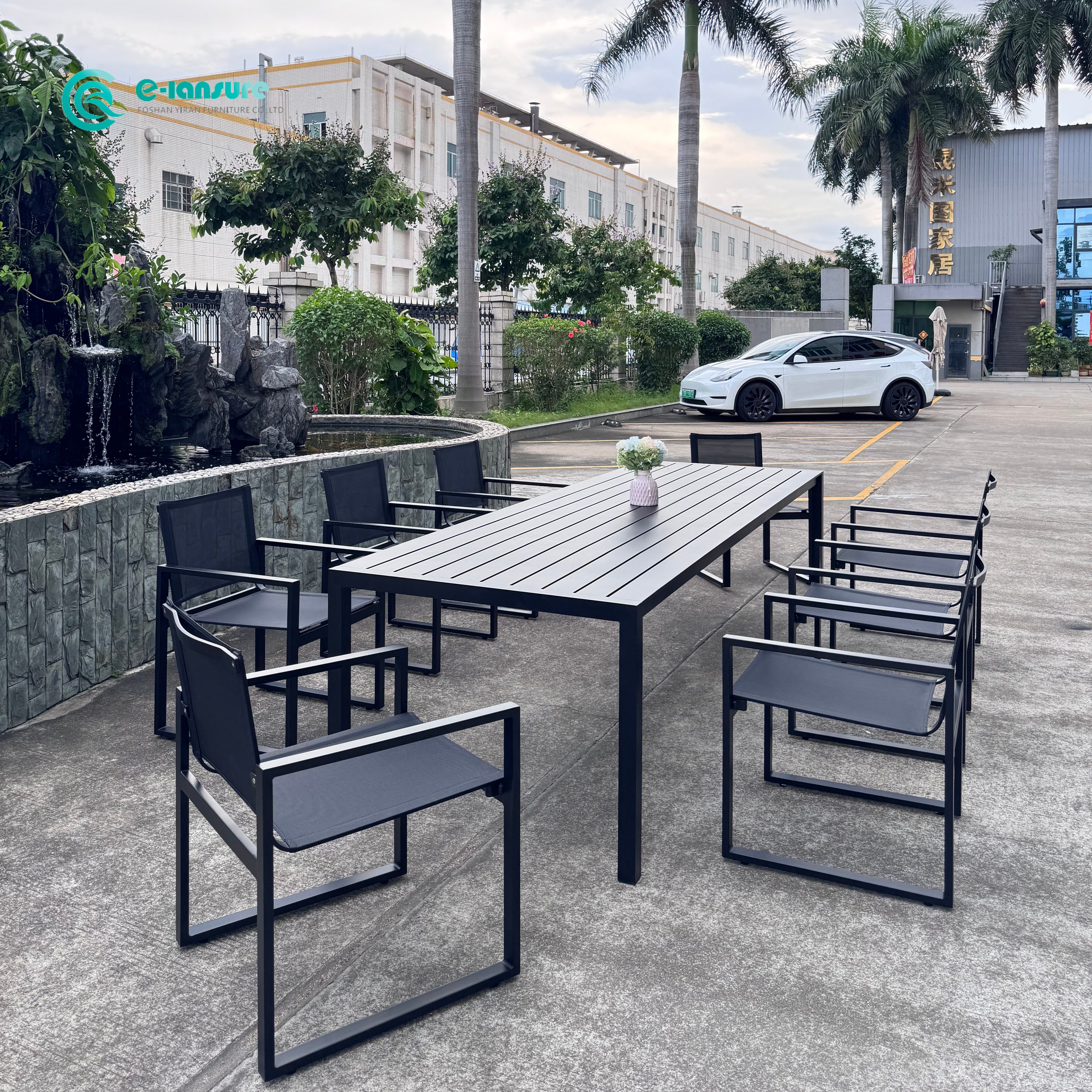 Mobili da pranzo all'aperto semplici e moderni con struttura in alluminio e sedia da pranzo da patio in Textilene 8+1 con un lungo set da tavolo per il cortile della villa
